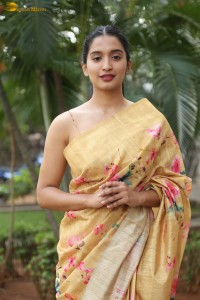 actress Bhavana Vazhapandal ravishing looks in a gold color saree