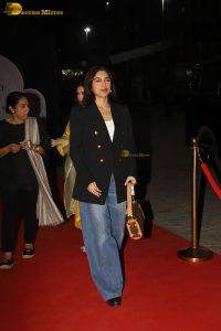 actress Bhumi Pednekar in a black suit and denim jeans at an event