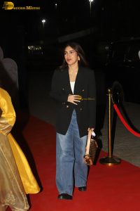 actress Bhumi Pednekar in a black suit and denim jeans at an event