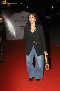 actress Bhumi Pednekar in a black suit and denim jeans at an event