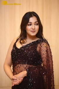 Actress Catherine Tresa dressed in a Black Saree
