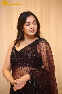 Actress Catherine Tresa dressed in a Black Saree