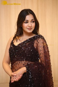 Actress Catherine Tresa dressed in a Black Saree