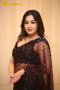 Actress Catherine Tresa dressed in a Black Saree