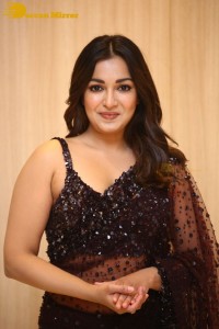 Actress Catherine Tresa dressed in a Black Saree