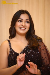 Actress Catherine Tresa dressed in a Black Saree