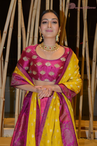 Actress Catherine Tresa in a pink dress at an event