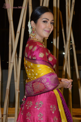 Actress Catherine Tresa in a pink dress at an event