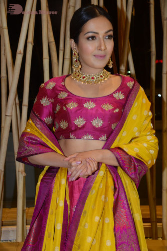 Actress Catherine Tresa in a pink dress at an event