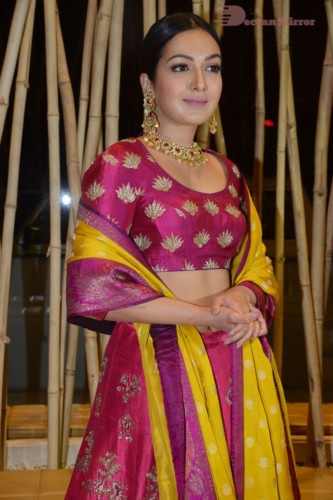 Actress Catherine Tresa in a pink dress at an event