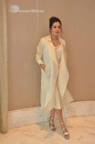 Picture of Actress Catherine Tresa photoshoot dressed in a white overcoat