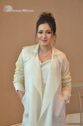 Picture of Actress Catherine Tresa photoshoot dressed in a white overcoat