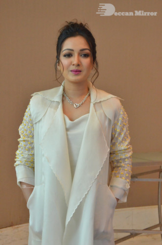 Picture of Actress Catherine Tresa photoshoot dressed in a white overcoat