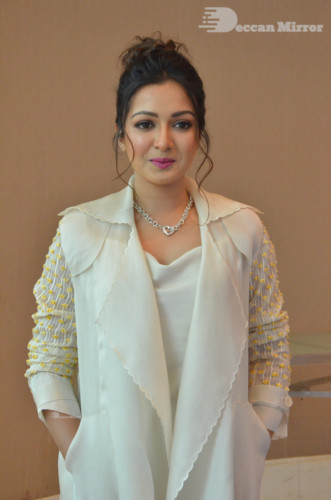 Picture of Actress Catherine Tresa photoshoot dressed in a white overcoat