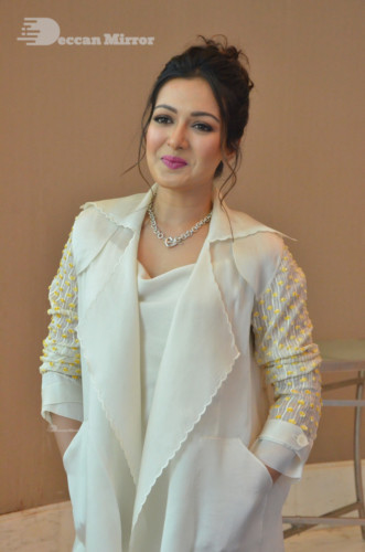 Picture of Actress Catherine Tresa photoshoot dressed in a white overcoat