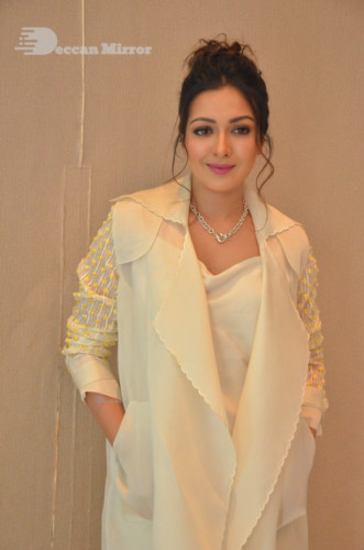 Picture of Actress Catherine Tresa photoshoot dressed in a white overcoat