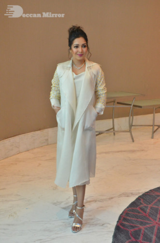 Picture of Actress Catherine Tresa photoshoot dressed in a white overcoat