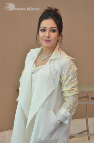 Picture of Actress Catherine Tresa photoshoot dressed in a white overcoat