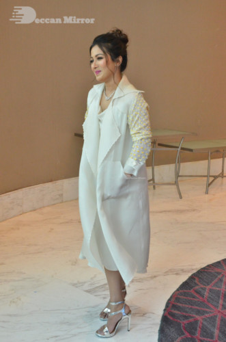 Picture of Actress Catherine Tresa photoshoot dressed in a white overcoat