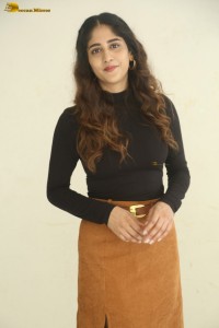 telugu actress Chandini Chowdary cute in a black top and brown skirt