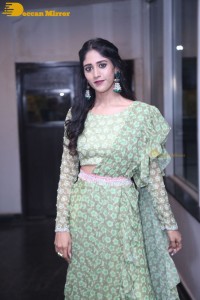 Actress Chandini Chowdary in a green dress