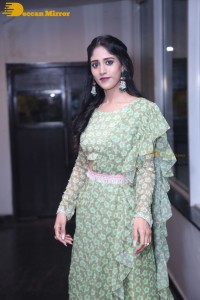 Actress Chandini Chowdary in a green dress