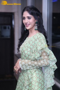 Actress Chandini Chowdary in a green dress