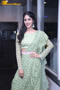 Actress Chandini Chowdary in a green dress