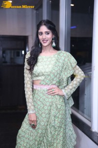 Actress Chandini Chowdary in a green dress