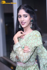 Actress Chandini Chowdary in a green dress