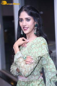 Actress Chandini Chowdary in a green dress