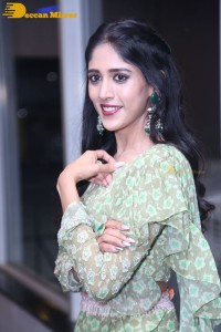 Actress Chandini Chowdary in a green dress