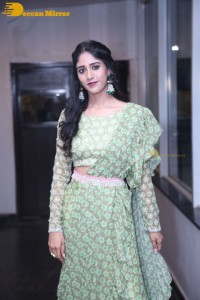 Actress Chandini Chowdary in a green dress