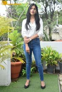 Telugu Actress Chandini Chowdary in a white shirt and denim jeans