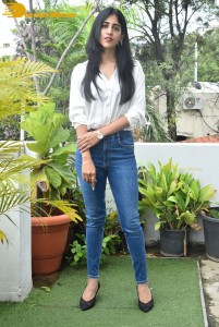 Telugu Actress Chandini Chowdary in a white shirt and denim jeans