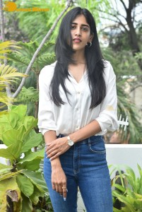 Telugu Actress Chandini Chowdary in a white shirt and denim jeans