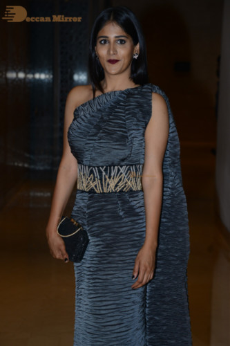 Actress Chandini Chowdary in a grey dress