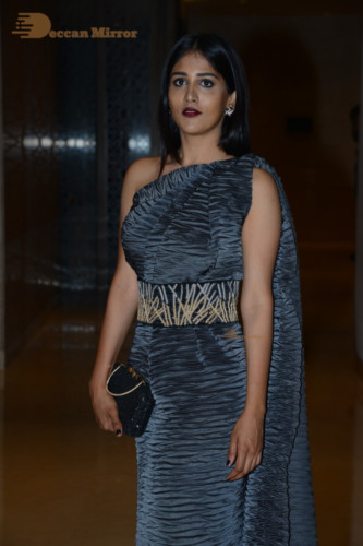 Actress Chandini Chowdary in a grey dress