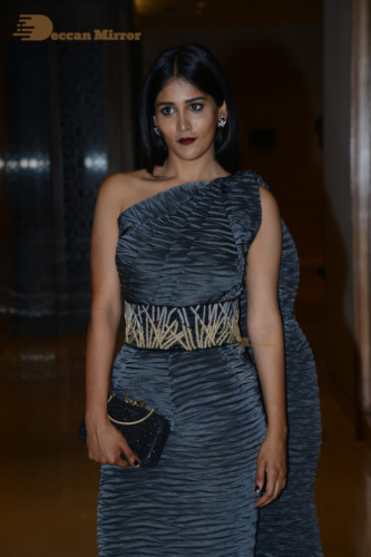Actress Chandini Chowdary in a grey dress