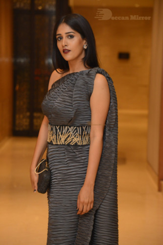 Actress Chandini Chowdary in a grey dress
