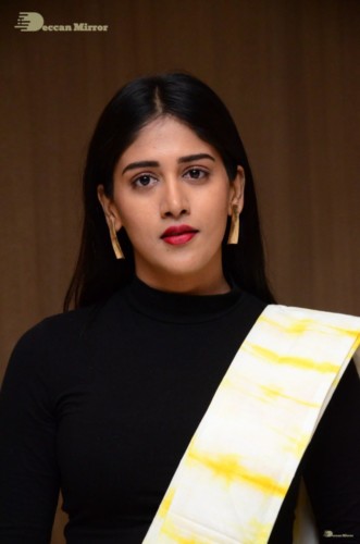 Telugu Actress Chandini Chowdary Photoshoot in a white and yellow half saree