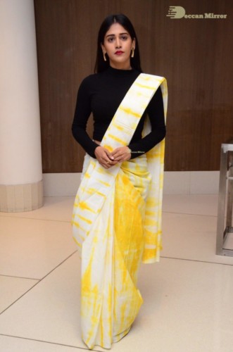 Telugu Actress Chandini Chowdary Photoshoot in a white and yellow half saree