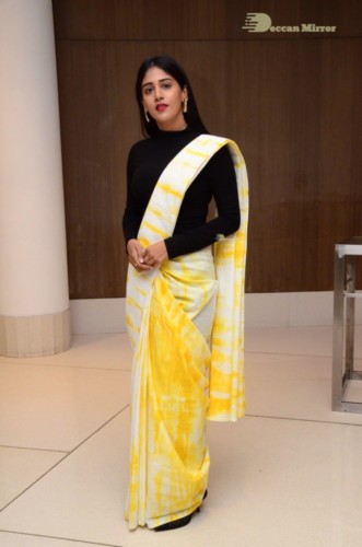 Telugu Actress Chandini Chowdary Photoshoot in a white and yellow half saree