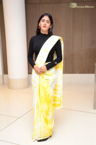 Telugu Actress Chandini Chowdary Photoshoot in a white and yellow half saree