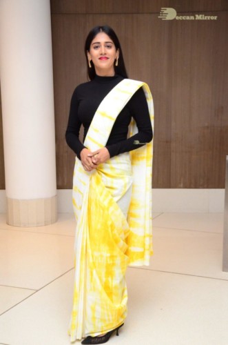 Telugu Actress Chandini Chowdary Photoshoot in a white and yellow half saree