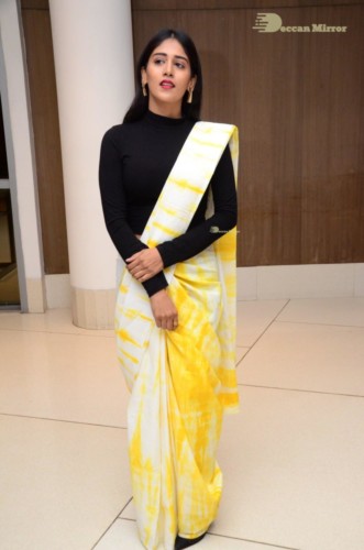 Telugu Actress Chandini Chowdary Photoshoot in a white and yellow half saree