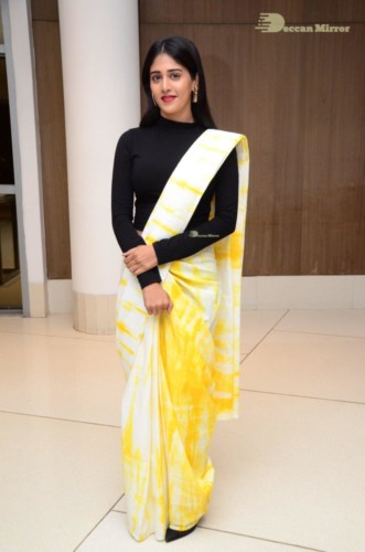 Telugu Actress Chandini Chowdary Photoshoot in a white and yellow half saree
