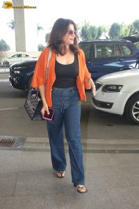 bollywood actress Chitrangada Singh stylish in a black top and orange shirt
