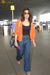 bollywood actress Chitrangada Singh stylish in a black top and orange shirt