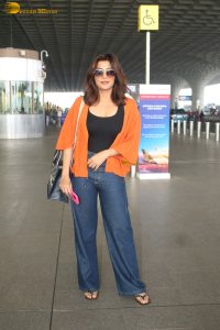 bollywood actress Chitrangada Singh stylish in a black top and orange shirt